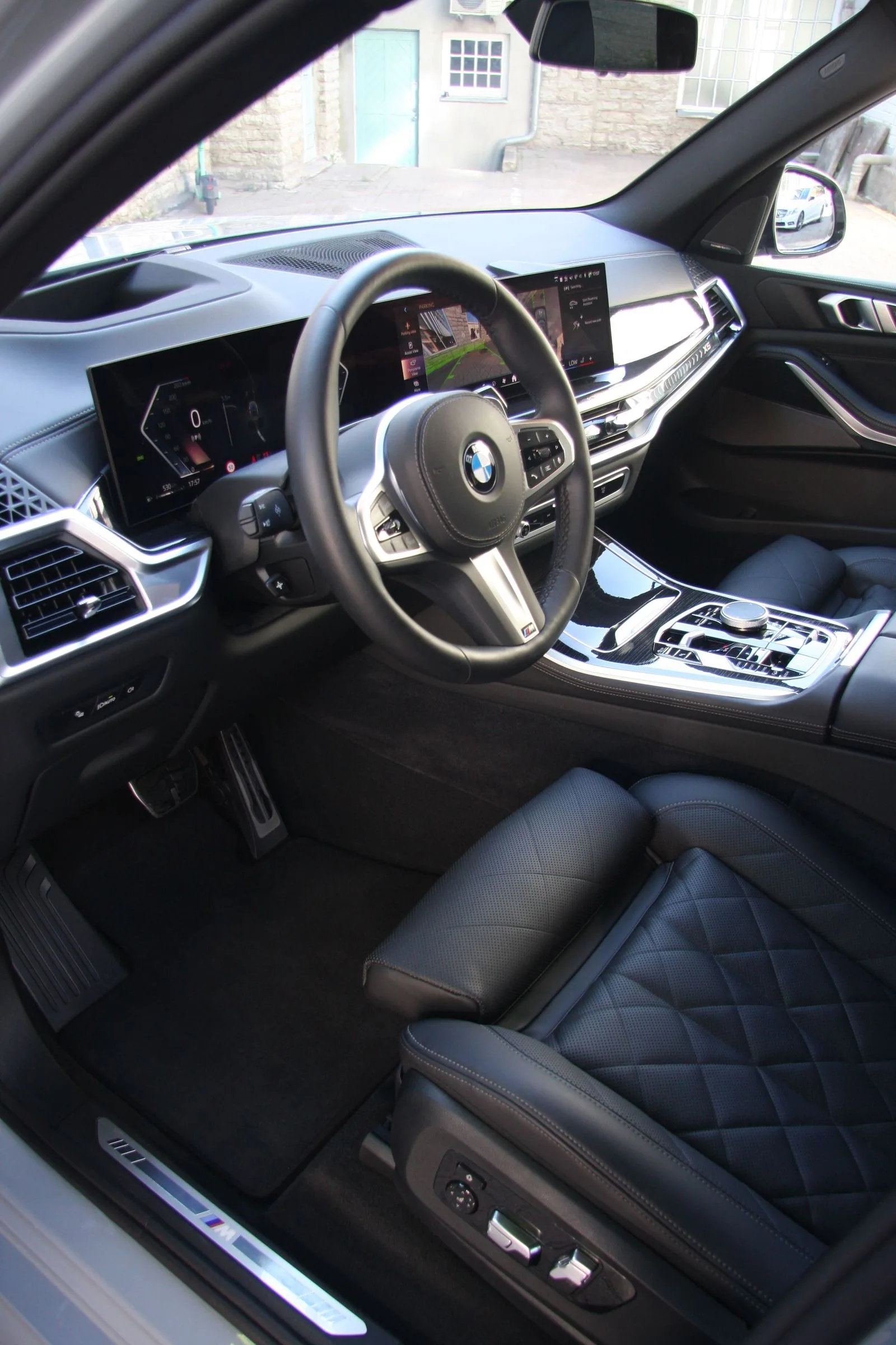 Clean BMW dashboard and driver's area.