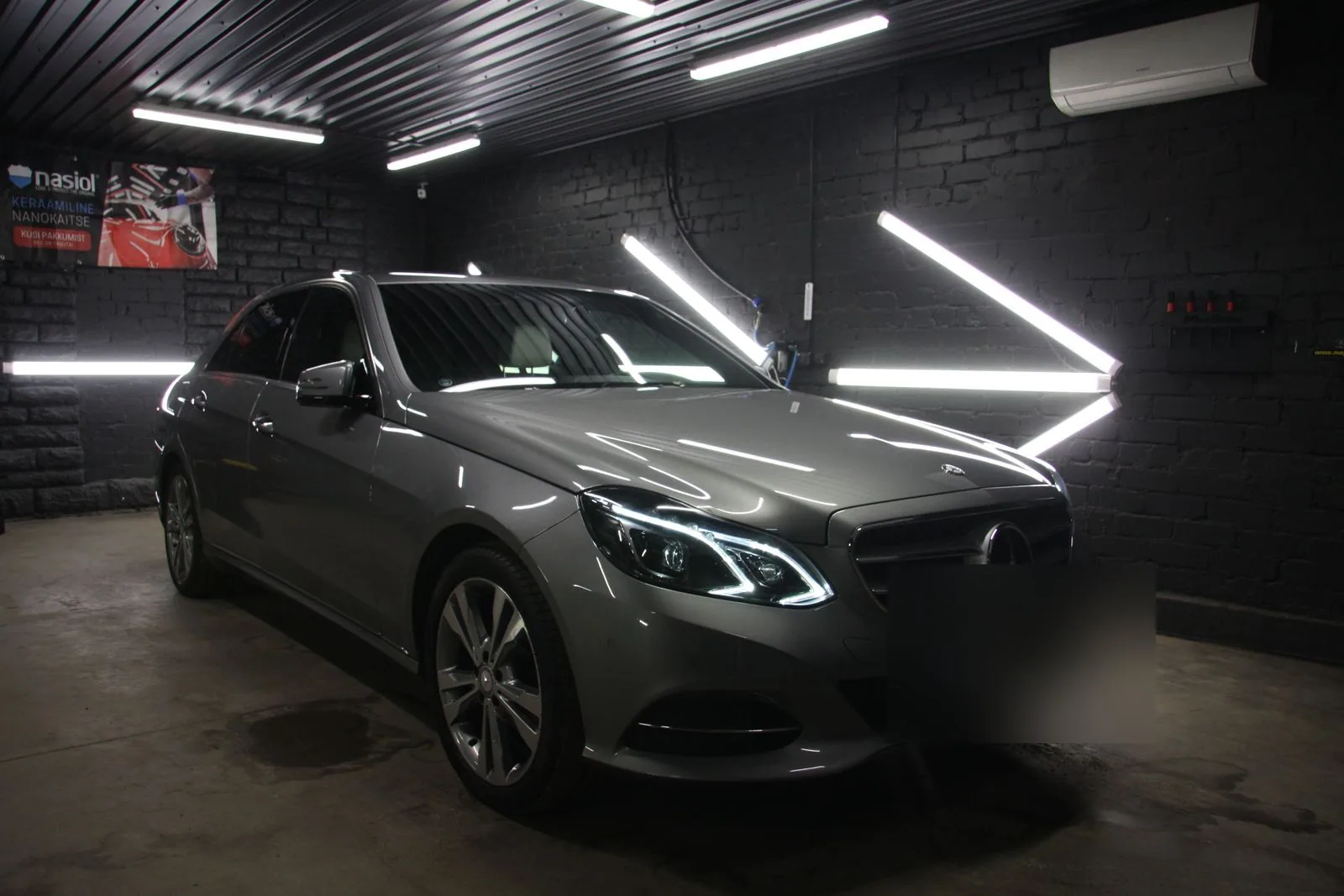Silver saloon in the illuminated Deus Detail studio.