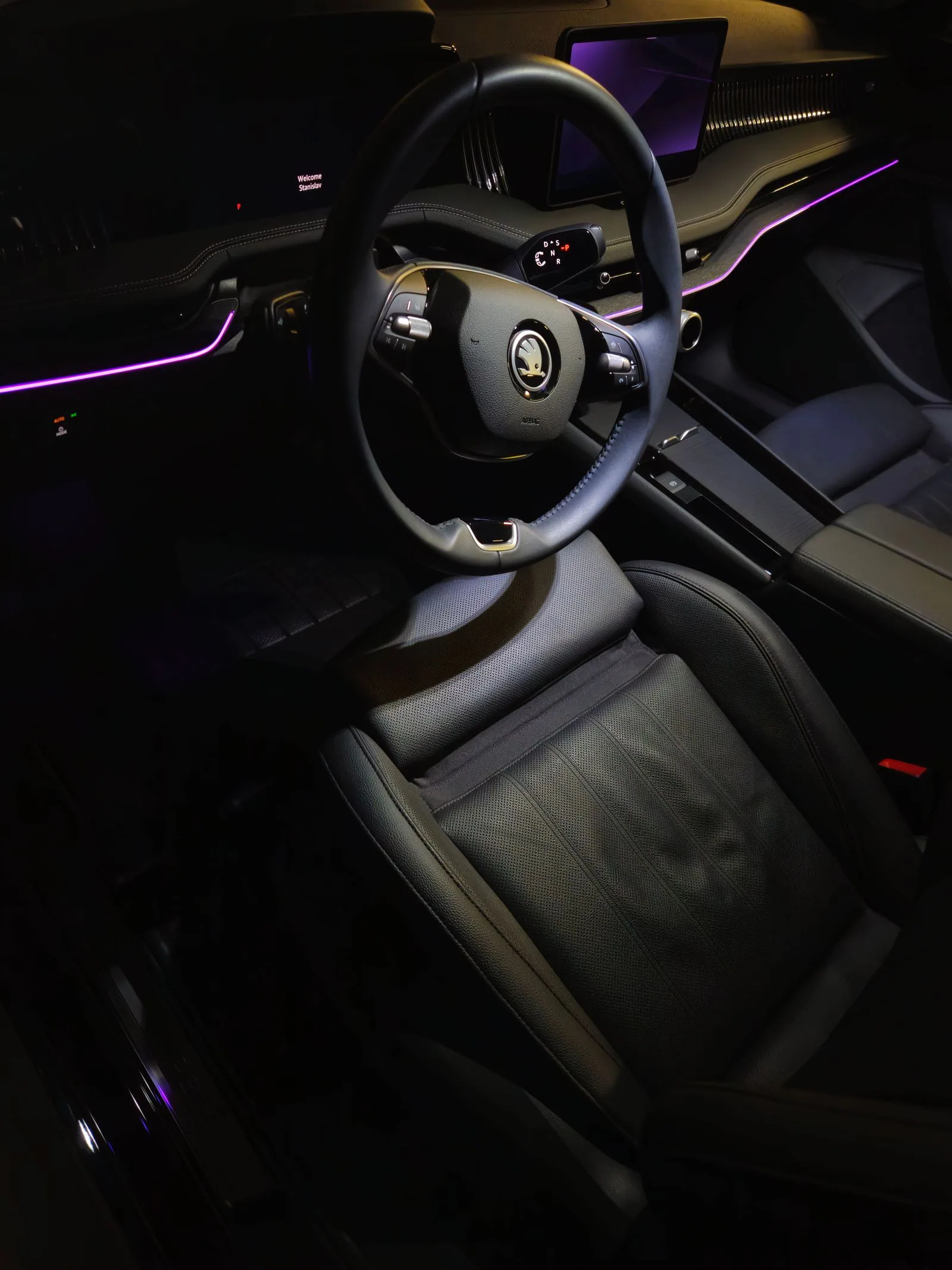 Clean Porsche interior with ambient lighting.