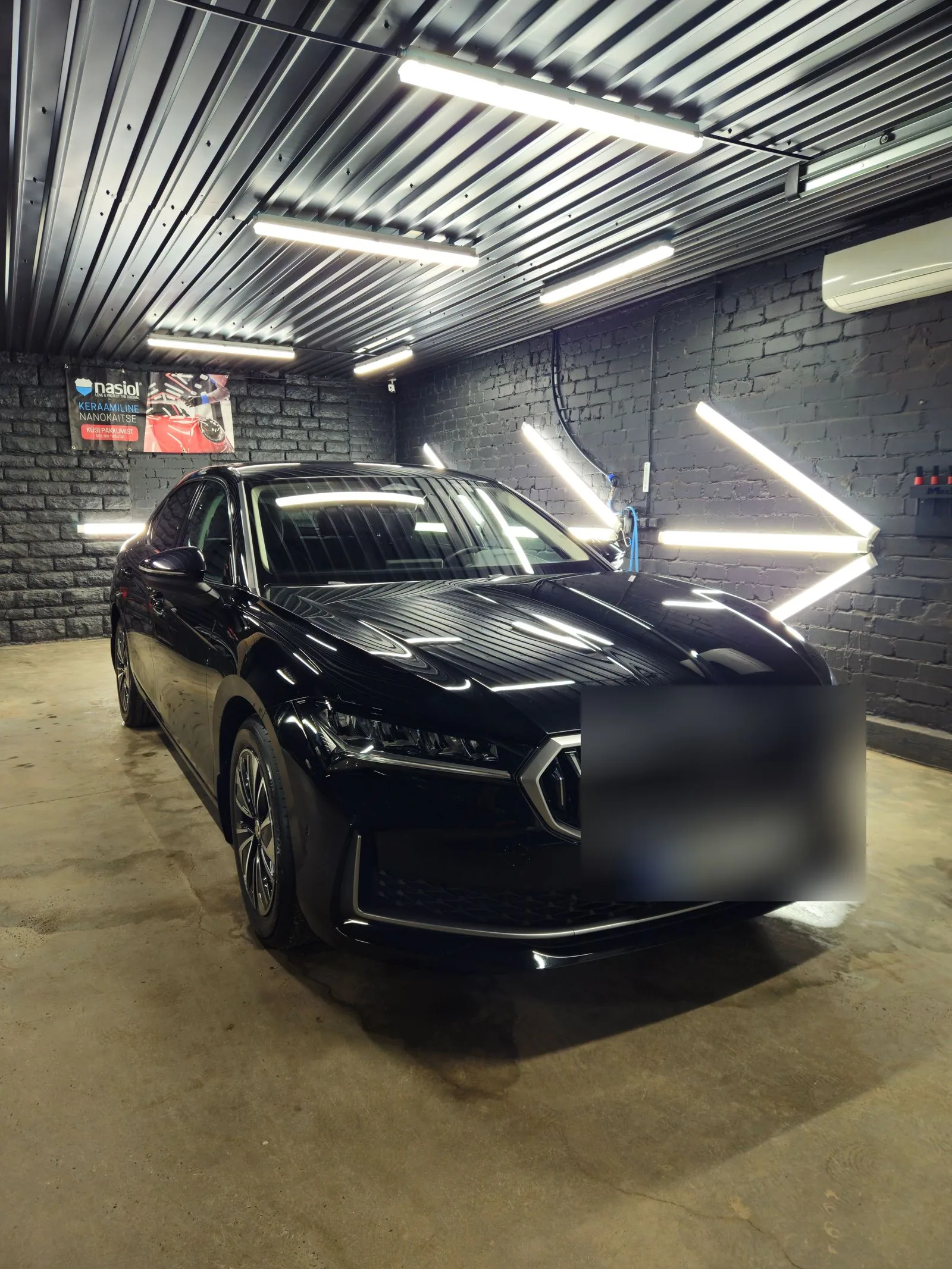 Black Skoda in the Deus Detail studio after Deus Premium care.